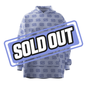 Light purple hooded blanket with dark purple repeating logo and a central anime girl patch with pink hair and glasses.