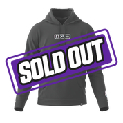 Black oversized hoodie with a large hood and ribbed cuffs and hem shown from the side.