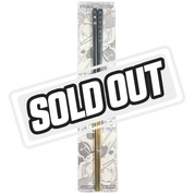 Black and gold chopsticks with white Japanese characters and a small heart on the black top section.