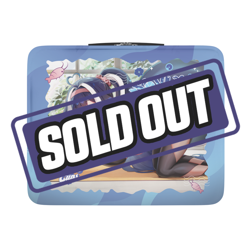 Navy blue lunch box with large light blue flower and "WOMP WOMP" text surrounded by bubbles and a small pink shrimp.