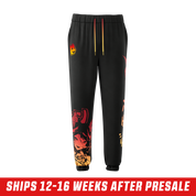 Black sweatpants with elastic cuffs and a red-to-yellow gradient Japanese-style graphic on the leg